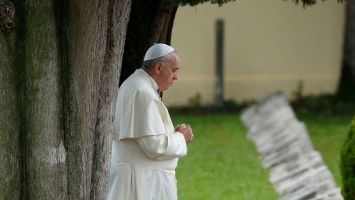 Pope Francis praying in nature