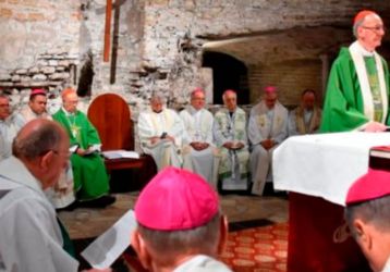 priests saying mass in the catacombs